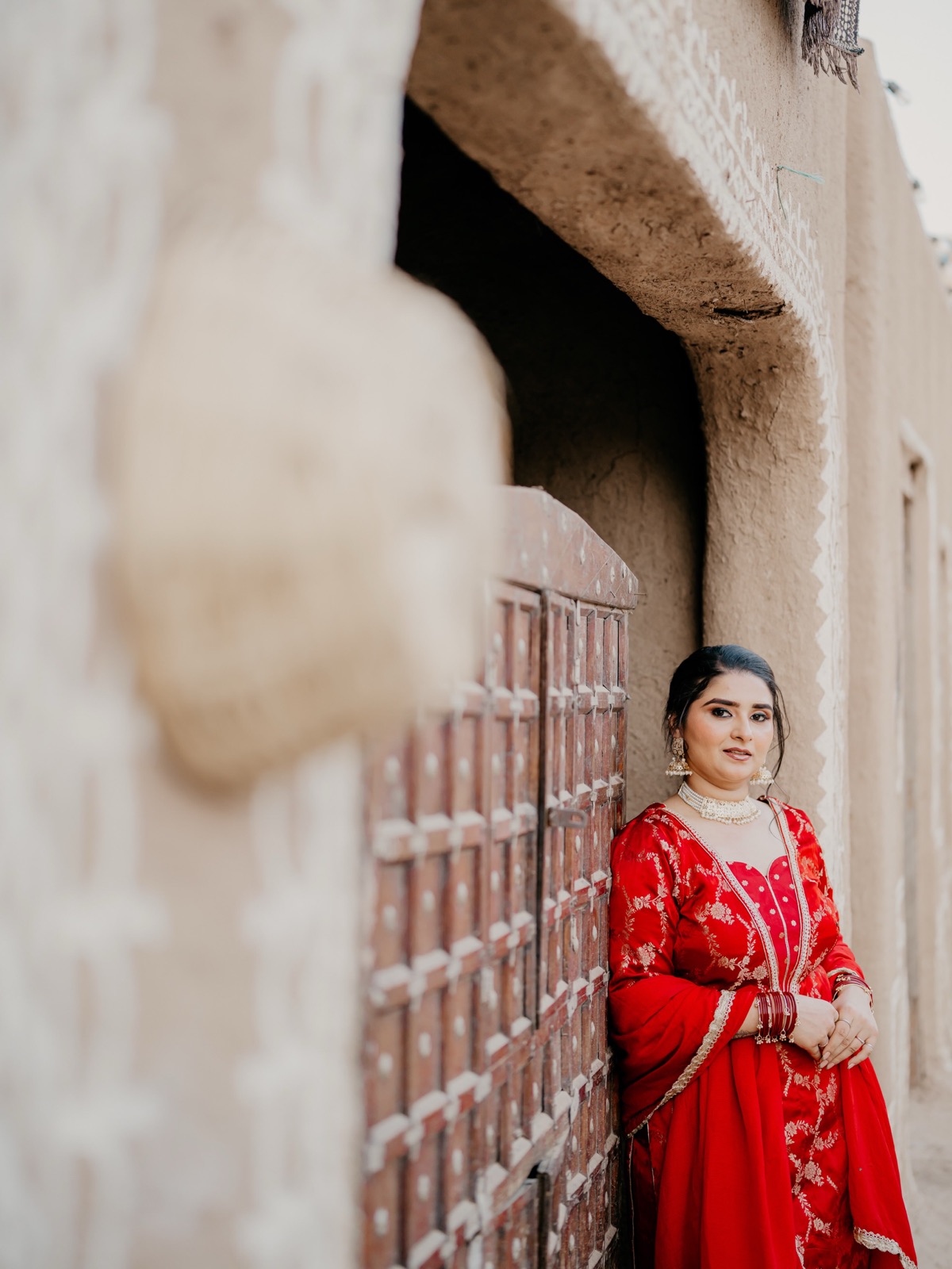 BeauteFest makeup paired with a red wedding outfit and traditional jewellery